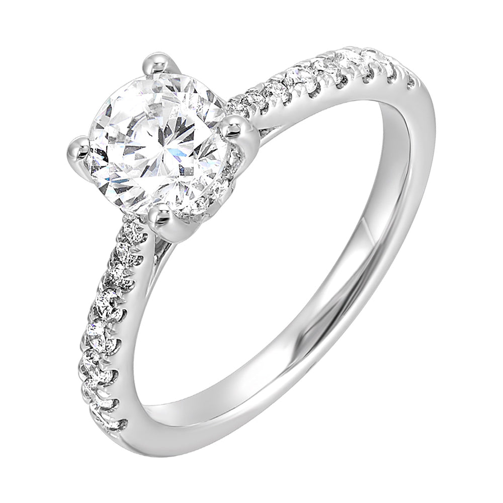 Delicate pave diamonds pinched towards the top add a touch of modern look, highlighting the solitare even further.