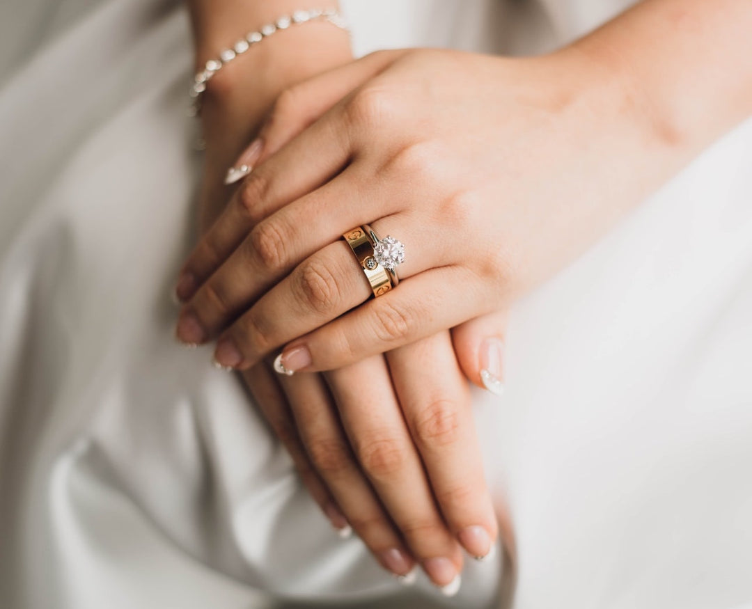 crossed hands, engagement ring, wedding band