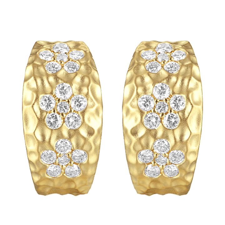 These captivating yellow gold earrings showcase floral designs made of brilliant diamonds set against gleaming gold. Accompanied by heart-shaped fastenings, they embody natures elegance.
