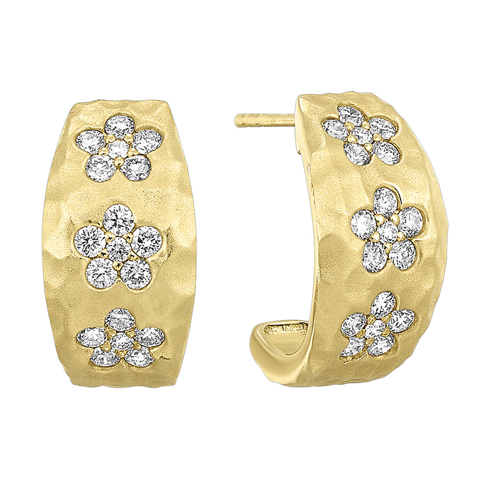 These captivating yellow gold earrings showcase floral designs made of brilliant diamonds set against gleaming gold. Accompanied by heart-shaped fastenings, they embody natures elegance.