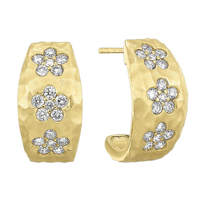 These captivating yellow gold earrings showcase floral designs made of brilliant diamonds set against gleaming gold. Accompanied by heart-shaped fastenings, they embody natures elegance.