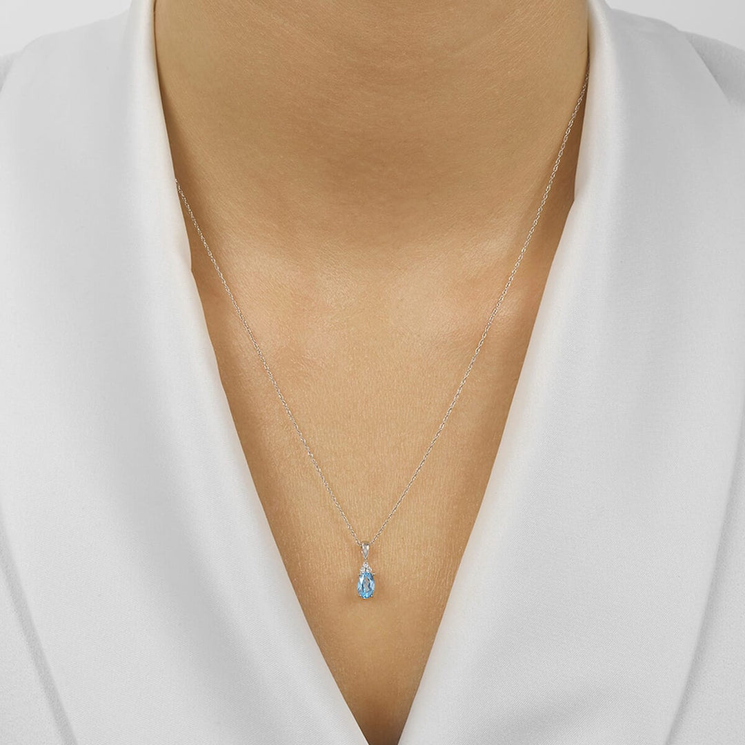 10Kt White Gold Diamond 1/50Ctw & Blue Topaz 3/8Ctw Pendant