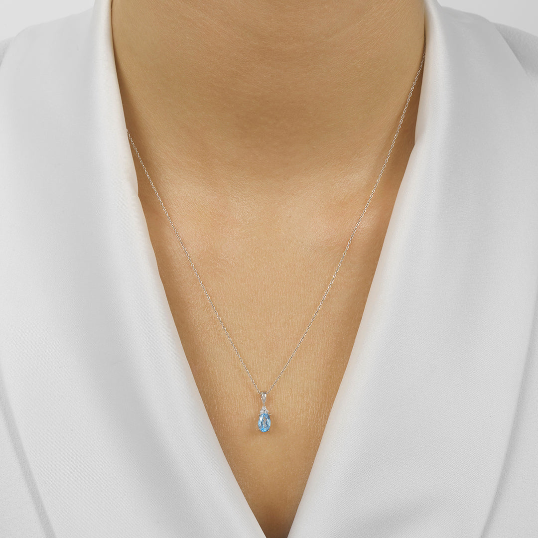 10Kt White Gold Diamond 1/50Ctw & Blue Topaz 3/8Ctw Pendant