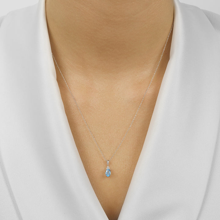 10Kt White Gold Diamond 1/50Ctw & Blue Topaz 3/8Ctw Pendant