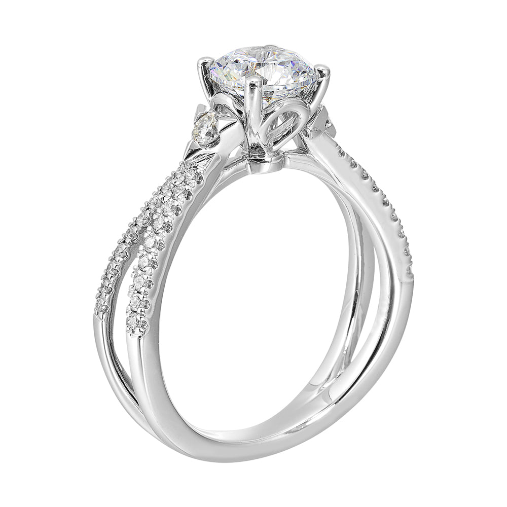 A split shank featuring two rows of diamond, sitting pretty right on top is the round solitare, with one round diamond on each side is sure a stunner.