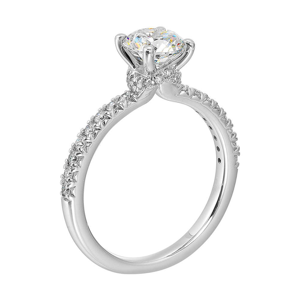 Round solitare meets sleek diamond pave offering timeless elegance.
