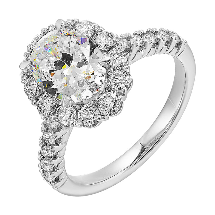 Featuring a mesmerizing floral halo around the solitare diamond adorned with sparkling diamonds on the shank is perfect for the classic you.