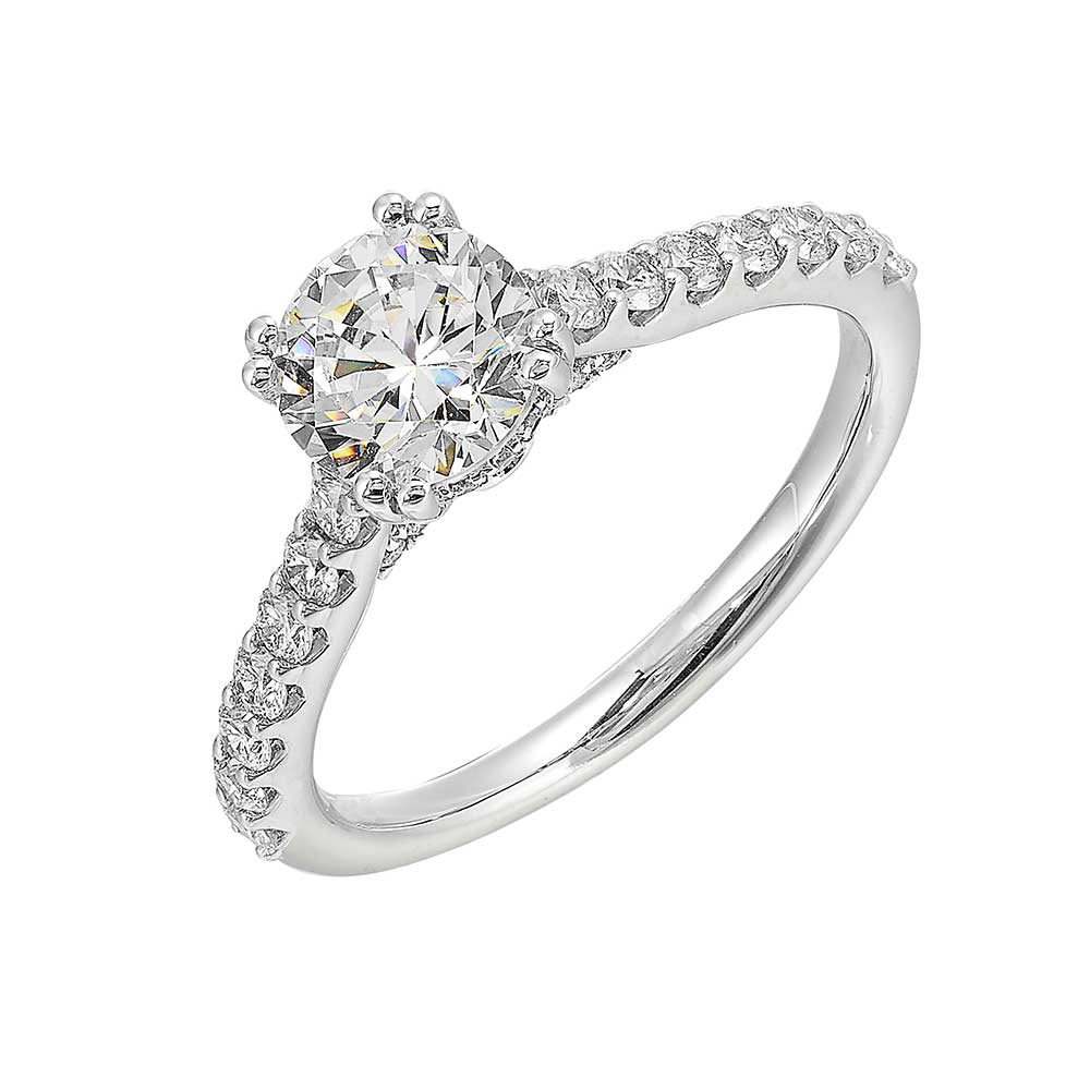 Celebrate a dazzling solitaire diamond set in dual prong on a sleek diamond shank making it a cherished symbol of your love.