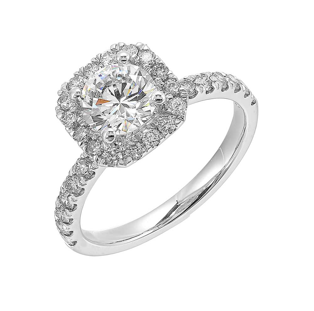 A sparkling round diamond takes center stage,  surrounded by a cushion halo and straight diamond shank. This unique design offers a touch of modernity.