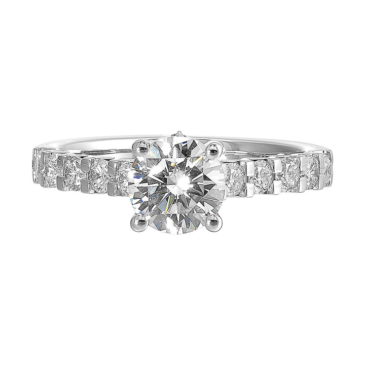 A solitaire takes center stage on a band elevated by diamonds set with common prongs along the shank is a timeless beauty.