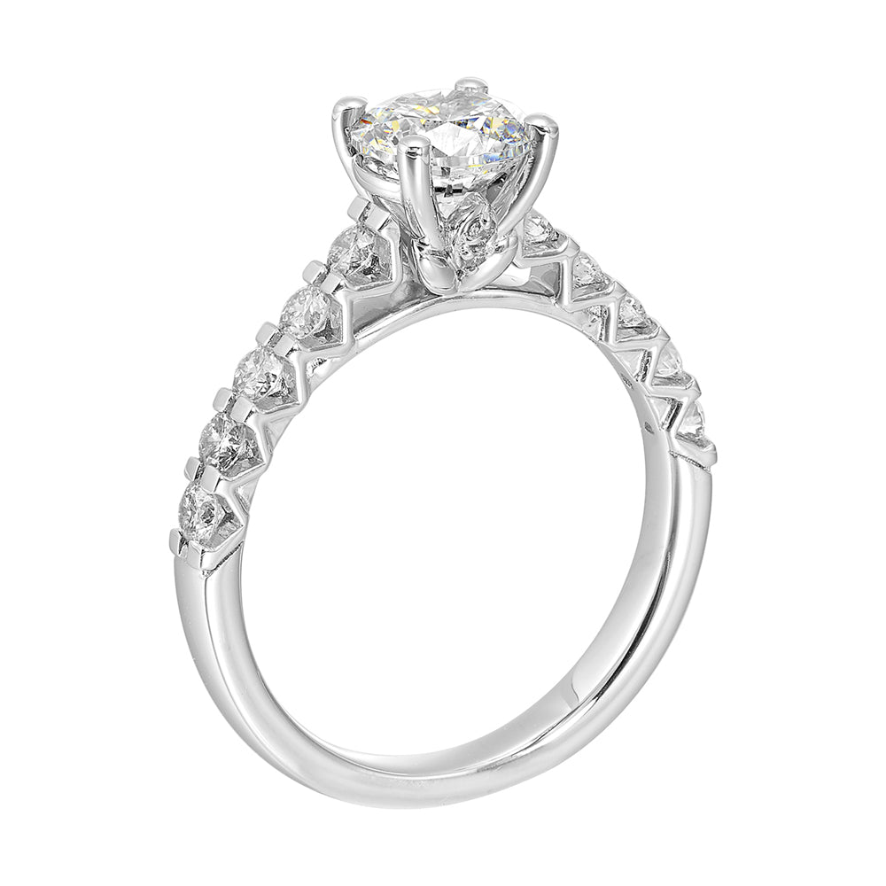 A solitaire takes center stage on a band elevated by diamonds set with common prongs along the shank is a timeless beauty.