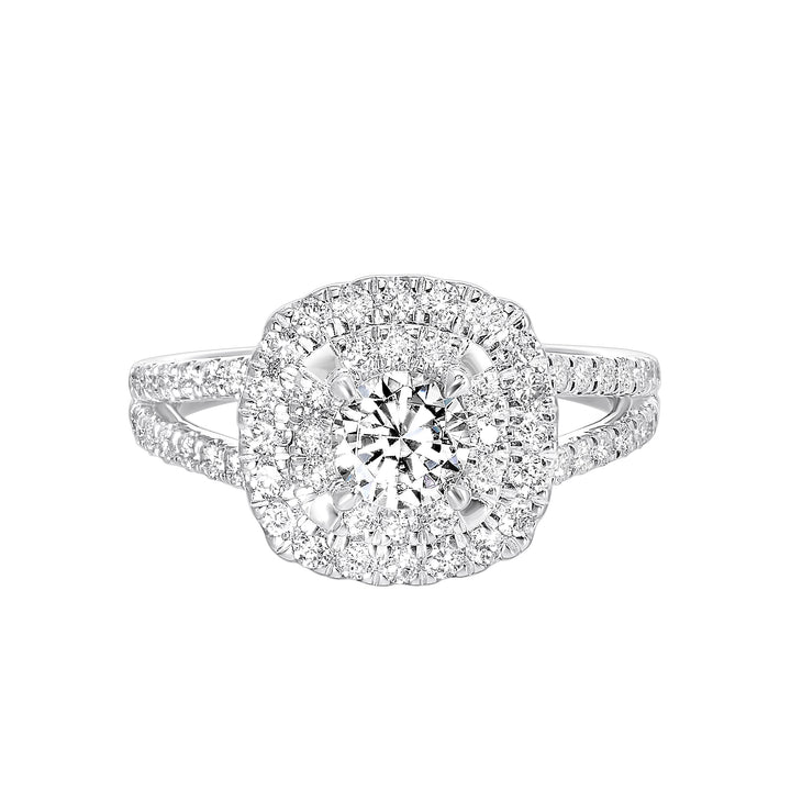 Elevated center surrounded by two sparkling cushion halos and split shank will mark your commitment to a lifelong promise