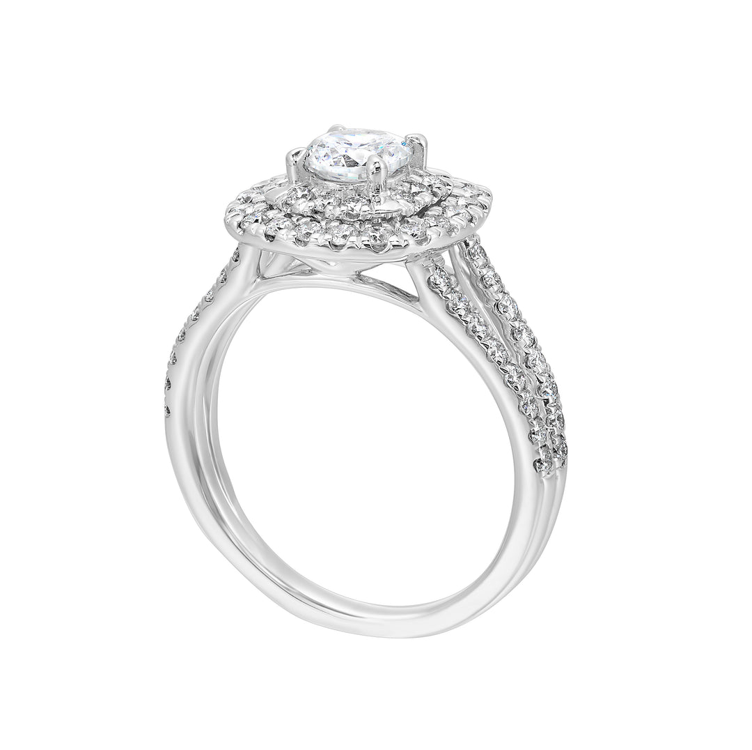 Elevated center surrounded by two sparkling cushion halos and split shank will mark your commitment to a lifelong promise
