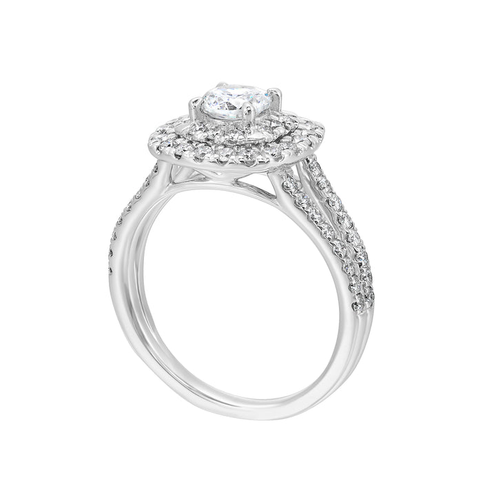 Elevated center surrounded by two sparkling cushion halos and split shank will mark your commitment to a lifelong promise