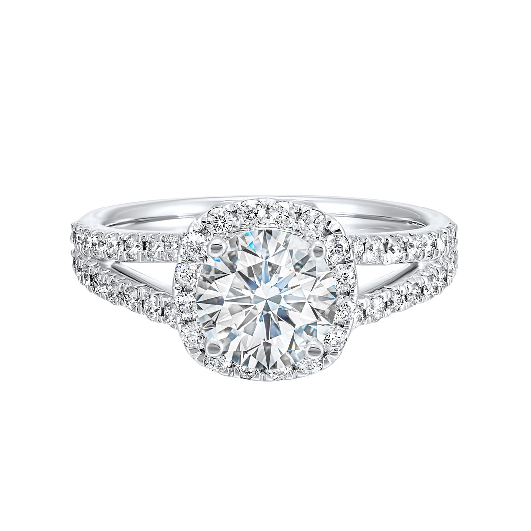 Cushion halo is a stunning way to showcase the round solitaire diamond. Modern split diamond studded shank further highlights the center.