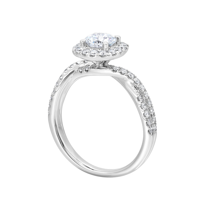 Pave diamonds embellish the loose twisted band. To top it off, diamonds in softer cushion halo  surround this mesmerizing diamond center.