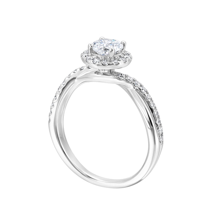 This feminine, modern diamond halo engagement ring features two strands, one with metal and one with pave diamonds intertwined in love.