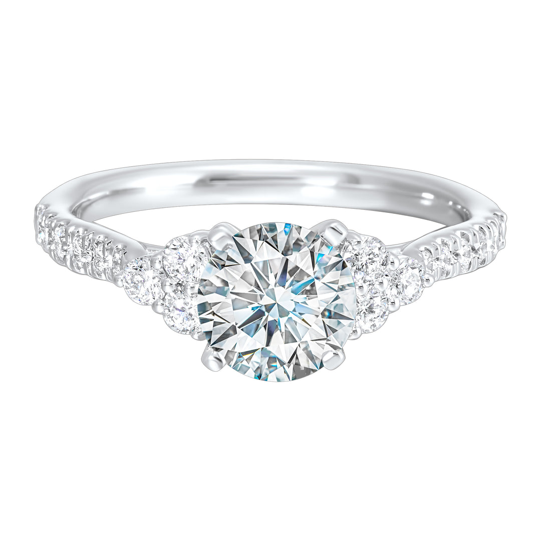 A trio of round diamonds on either side of the solitaire followed by a diamond studded shank, this ring is sure to impress her.