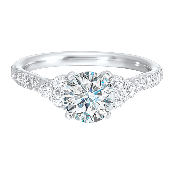 A trio of round diamonds on either side of the solitaire followed by a diamond studded shank, this ring is sure to impress her.