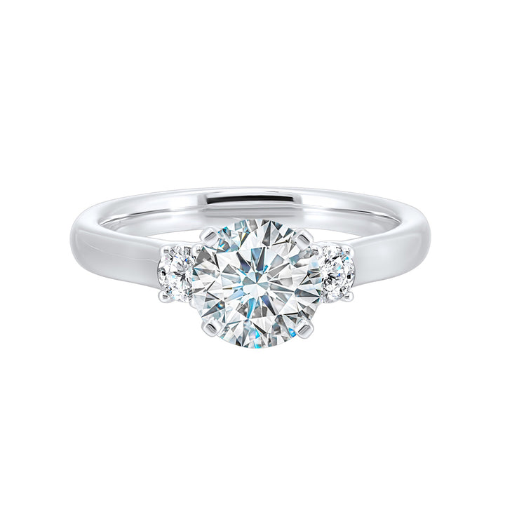 Classic and romantic, this three stone engagement ring features the bold gold shank to sparkle your moments further.