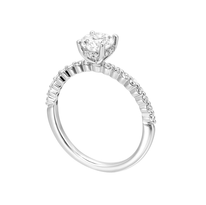 This lovely engagement ring consists of brilliant cut center diamond with single prong set diamonds along the shank and  finishing touches of added diamonds details in front.