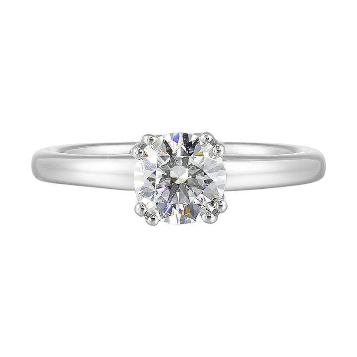 Chic and unique, this double prong setting solitare adds to the sleek, classic look to her style.