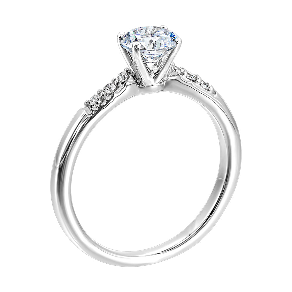 Complement your center diamond perfectly with accented pave-set diamonds along the shoulders of the shank.