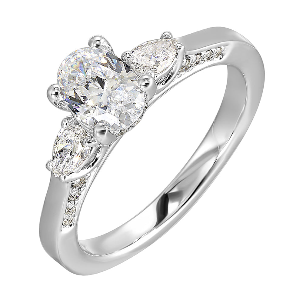 Three stone ring features an oval cut solitare nestled inbetween pear cut diamond,  all embellished with sparkling diamond accents in front.