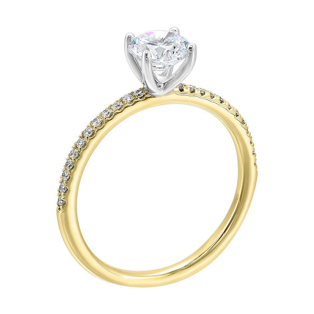 A solitaire ring features a delicate micro pave diamond shank, adding a touch of brilliance, is a timeless classic choice.