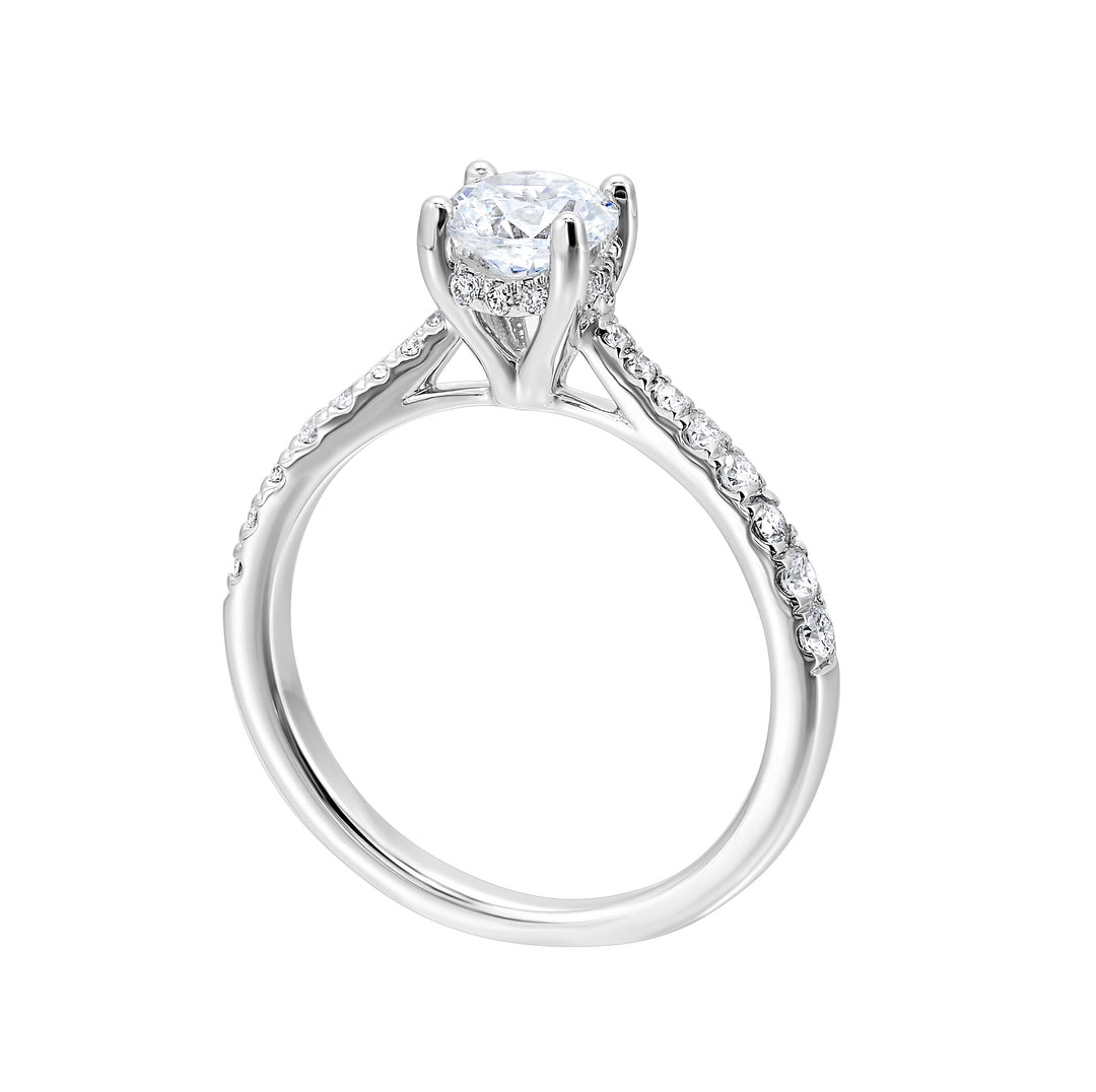 Reverse tapered band on this solitaire engagement ring draws your eye to the sparkling round solitare making it the focal point.