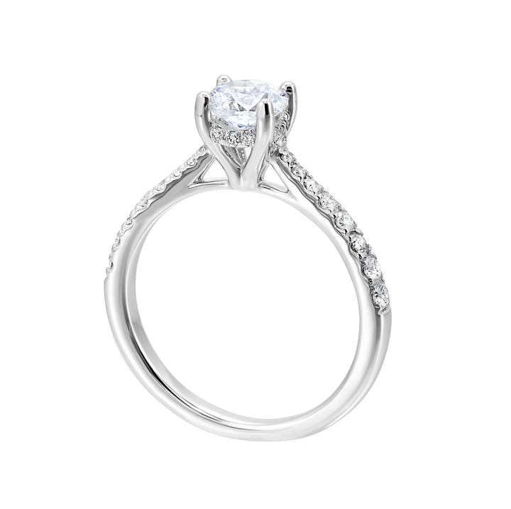 Reverse tapered band on this solitaire engagement ring draws your eye to the sparkling round solitare making it the focal point.