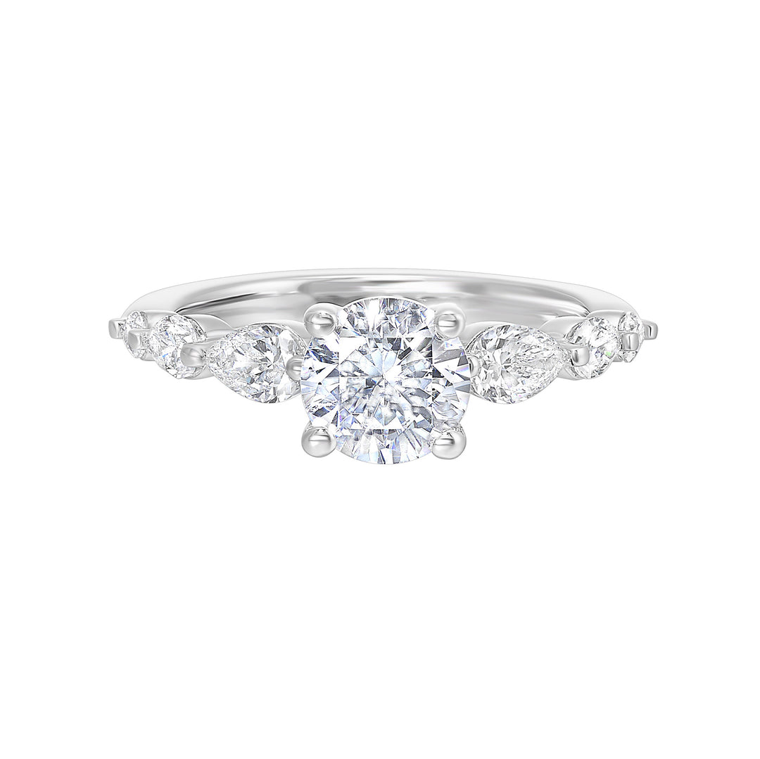 Round solitaire meets graduating pear cut diamonds set in common prongs blending classic elegance with contemporary style.