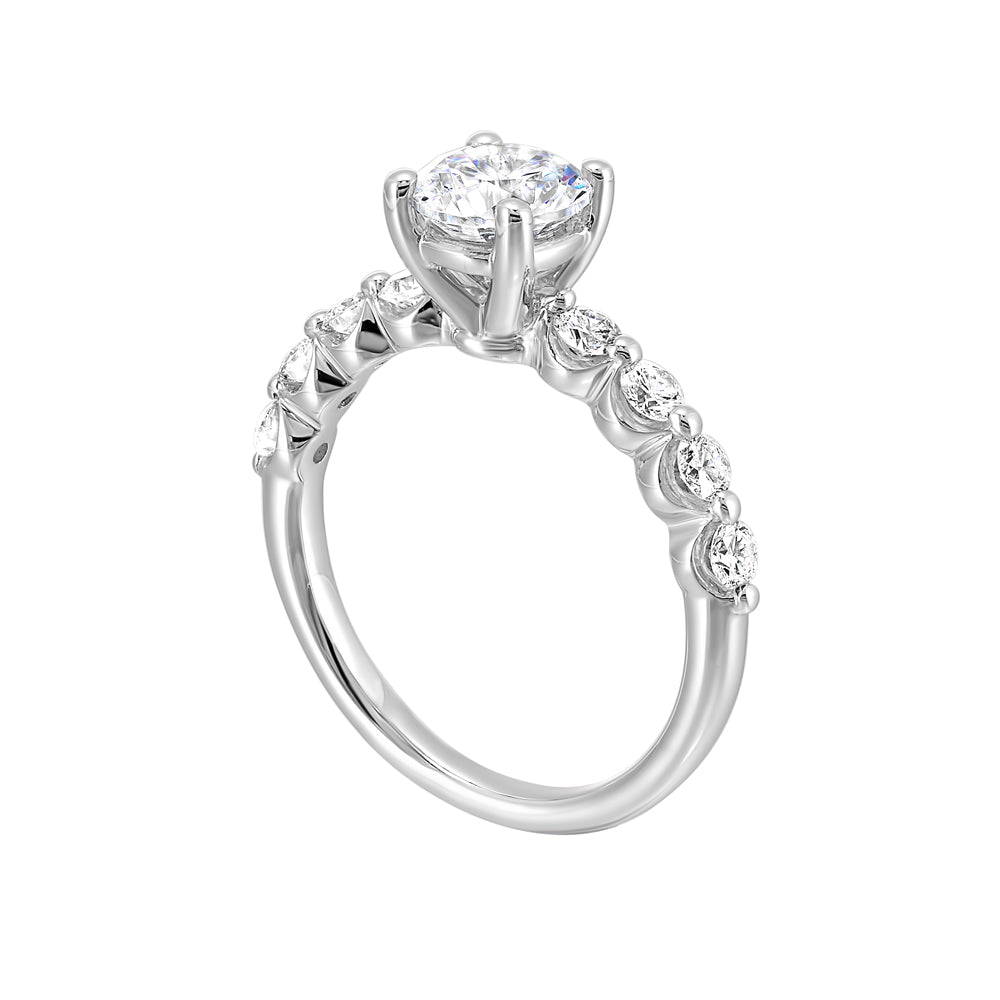 This lovely solitare ring is accented with bigger accent diamonds along the shank showcases the timeless love.