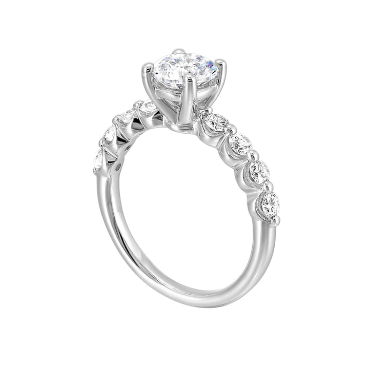 This lovely solitare ring is accented with bigger accent diamonds along the shank showcases the timeless love.