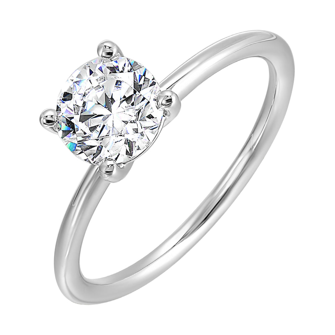 Classic four prong solitaire engagement ring with a petite band adds to the sleek,  classic look of the design.