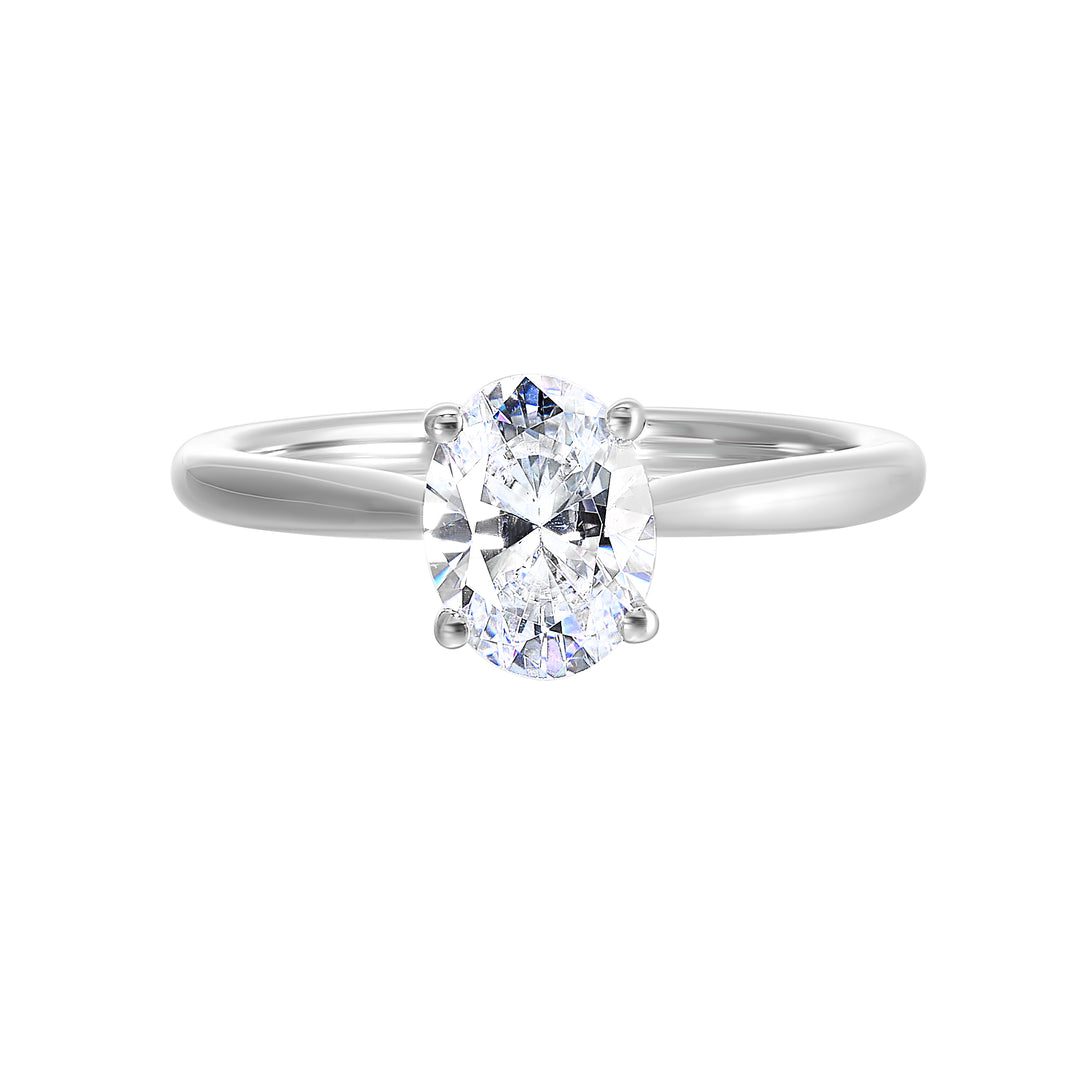 Effortless and classy this dazzling four prong oval solitaire ring features a clean, classic look with a sleek band.