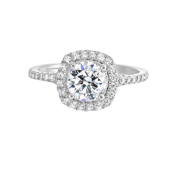 Sparkling cushion halo features beautiful set pav? diamonds that encircle the center solitare and adorn the band.