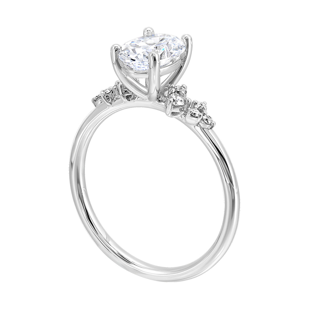This simply gorgeous engagement ring with oval center features a sleek gold band with floating diamonds on either sides in random placement coming together beautifully.