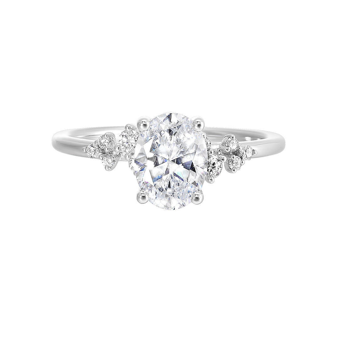 This simply gorgeous engagement ring with oval center features a sleek gold band with floating diamonds on either sides in random placement coming together beautifully.