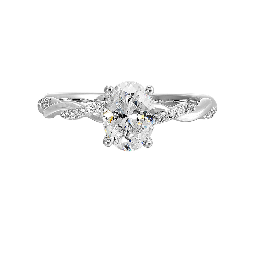 This ring is is sure to surprise her, featuring an oval center which is further enhanced by play of diamond and metal twist shank.