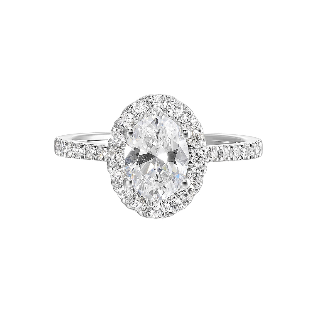 Oval solitaire halo ring with sleek diamond studded shank, this design offers a romantic look for your special moments.