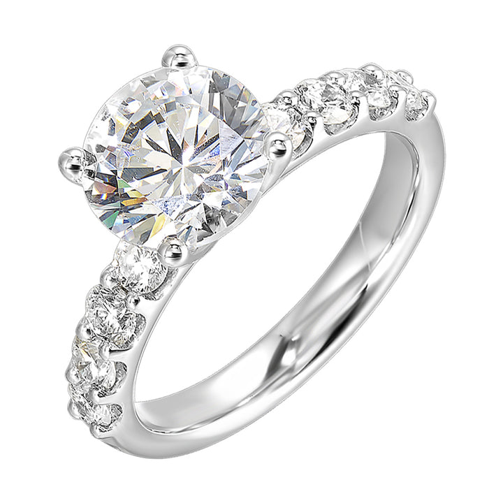 Bigger round diamonds rest on either side of this solitaire engagement ring, creating a modern yet timeless look.