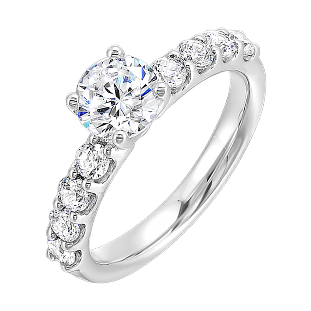 Bigger round diamonds rest on either side of this solitaire engagement ring,  creating a modern yet timeless look.