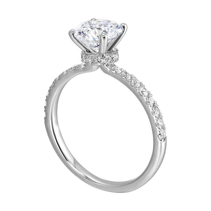 Shine from every angle with this gorgeous round solitaire hidden halo engagement ring. This timeless design offers elegance making it everlasting symbol of your love.