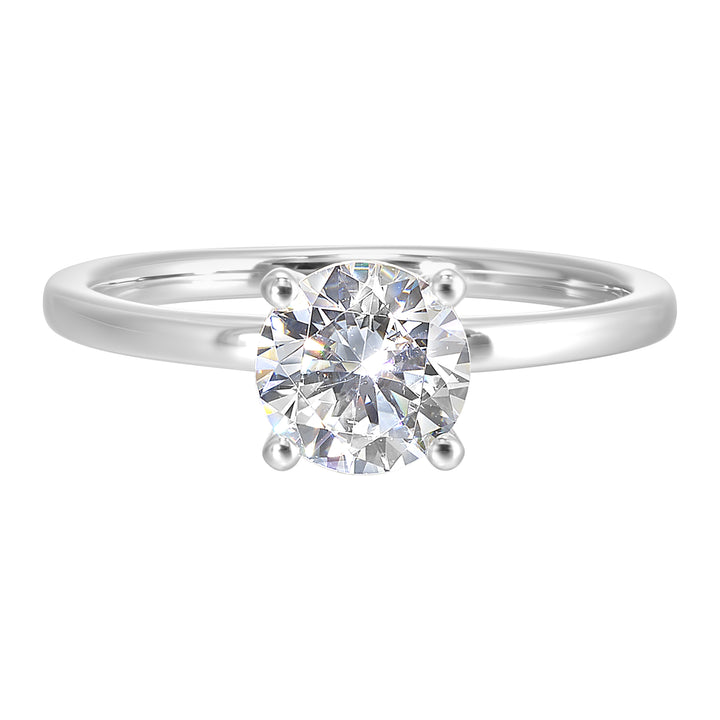 The dazzling solitaire diamond take center stage. The petite band adds to the sleek, classic look.