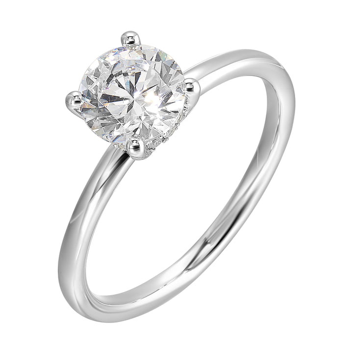 The dazzling solitaire diamond take center stage. The petite band adds to the sleek, classic look.