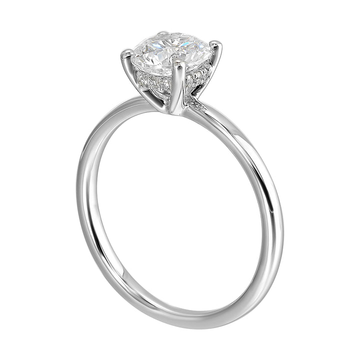 The dazzling solitaire diamond take center stage. The petite band adds to the sleek, classic look.
