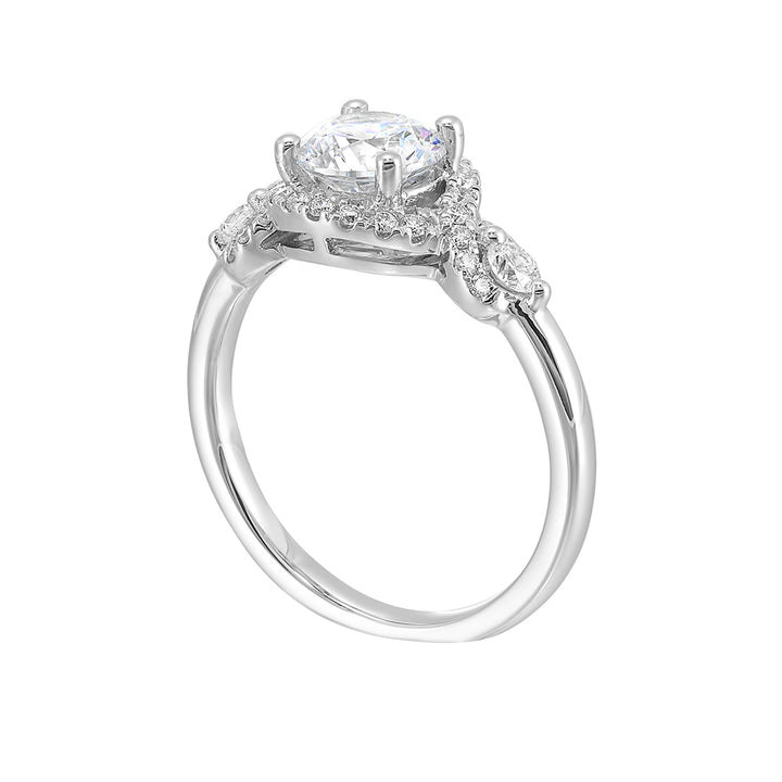 Encircling the base of solitare center with pave of glittering diamonds this three stone ring is sure to enchant her.