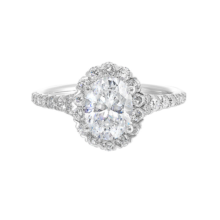 This breathtaking engagement ring combines classic and modern styles with a dazzling oval center and halo followed by a tapered shank look.