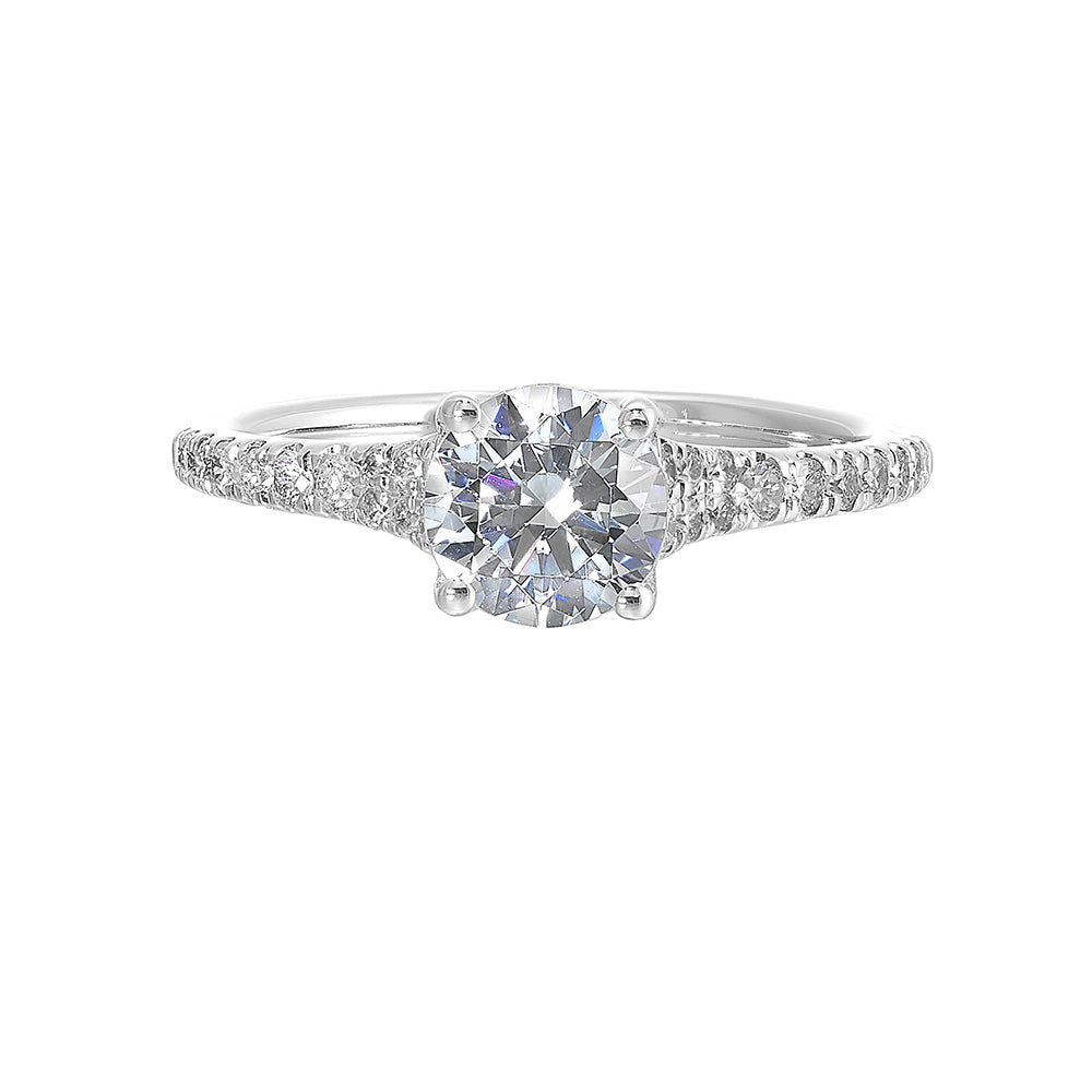Defined by a tapered shank set with graduated round diamonds,  this classic solitaire engagement ring is a classy choice